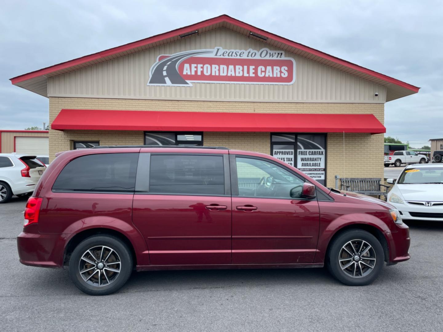 2017 Maroon Dodge Grand Caravan Passenger (2C4RDGBG9HR) with an V6, Flex Fuel, 3.6 Liter engine, Automatic, 6-Spd transmission, located at 8008 Warden Rd, Sherwood, AR, 72120, (501) 801-6100, 34.830078, -92.186684 - Photo#0